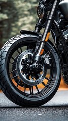 Motorcycle Front Wheel CloseUp View On Asphalt Road With Blurred Forest Background