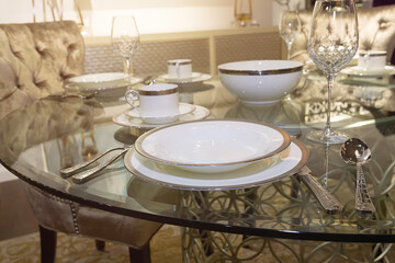 Plates and glasses on the table. Luxurious serving