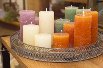 Multicolored decorative candles on the table