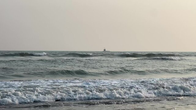 An Indian submarine nearing the Puri sea beach during Navy day in Orissa 2025.
