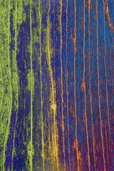 Colorful abstract texture with green blue and orange stripes
