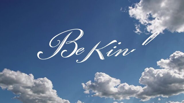 Inspiring skywriting message of kindness against beautiful cloudy blue skies