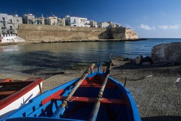 Monopoli, district of Bari, Puglia, Italy, Porta Vecchia cove in the background the fortified walls...