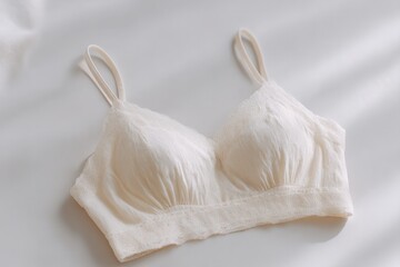 delicate fabric bra rests gracefully on pristine white backdrop