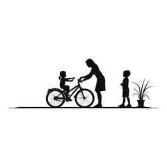 Obraz premium Mother Helping Daughter Learn to Ride a Bicycle/Silhouette of a mother assisting her young daughter learning to ride a bicycle.