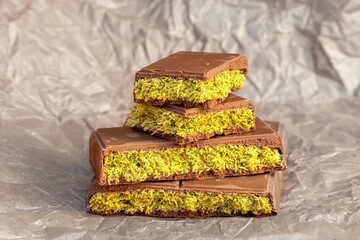Luxury trending Dubai chocolate with creamy pistachio filling and crispy kataifi dough. Middle Eastern sweets