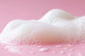 The image of soft white bubbles against a pink background is one that evokes a feeling of freshness