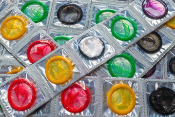 Colorful condoms background.