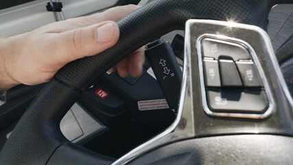 In this instructional clip, the driver shows how to effectively use the bus turn signal light switch located on the steering wheel. Clear steps ensure safe signaling on the road.