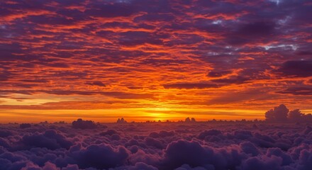Fototapeta premium Sunset Above Cloud Sea Dramatic Hues - A breathtaking sunset paints the sky with vibrant orange and purple hues, casting a dramatic glow on a sea of clouds below. Symbolizing hope, serenity, beauty