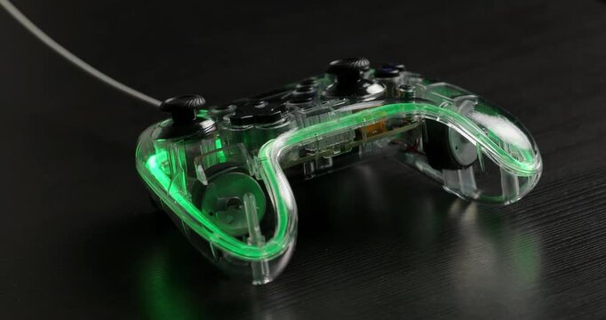 Gamepad, game controller charging glowing vibrant rgb light. 