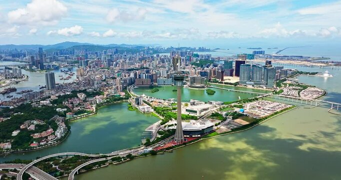 Aerial view panorama of Macau cityscape skyline and tower surrounded by bridges and buildings.