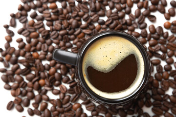 cup of freshly brewed black coffee and roasted coffee beans on white background i