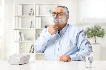 Man treating respiratory illness with a nebulizer