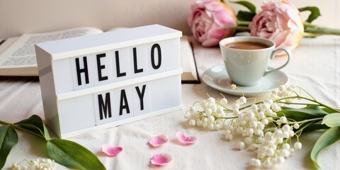 hello may sign with flowers and cup of coffee