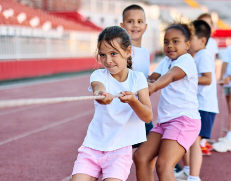 child sport exercise athlete rope competition strength challenge teamwork effort pulling pull tug rivalry struggle war conflict power contest team fun - Powered by Adobe