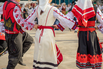People dressed with traditional Bulgarian authentic folklore clothes dance Bulgarian dance....