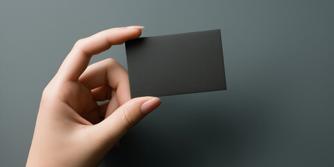 female hand holding black business card mockup