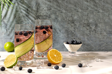 Refreshing summer drink recipe, Cold homemade lemonade or cocktail with chia seeds, blueberries,...