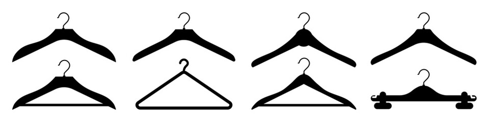Set of black clothes hangers of different shapes. Neat arrangement in the closet. Vector isolated illustration.