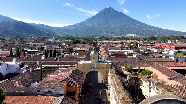 Beautiful aerial footage of the colonial town of Antigua Guatemala. The Yellow arch clock of Santa Catalina Convent, Cathedral Antigua and the Royal Palace of the Captains General