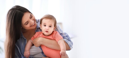 Happy mother with adorable baby boy at home. Banner for design
