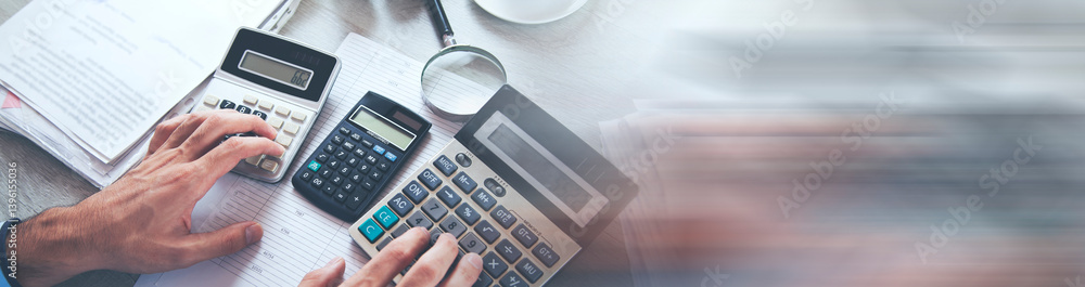 Poster business person calculating invoices using calculator in office