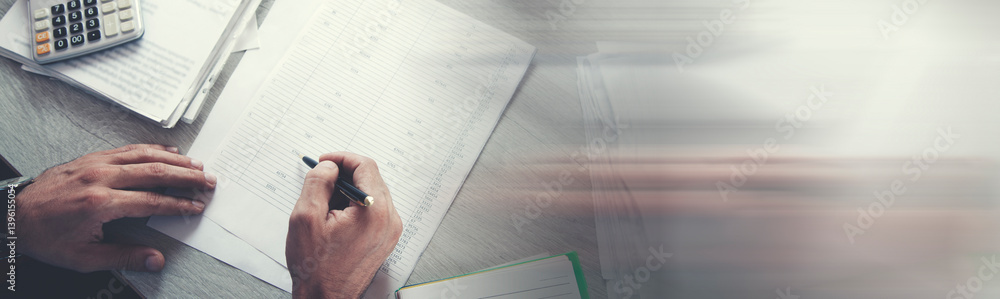 Poster business person calculating invoices using calculator in office