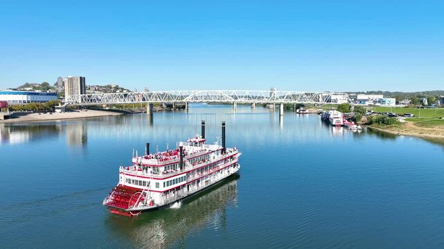 Aerial Tracking Shot: Cincinnati Riverboat and Skyline Over Ohio River