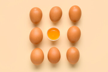 Raw chicken eggs on yellow background