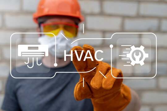 Engineer using virtual touch screen presses text: HVAC. Concept of HVAC or Heating Ventilation Air Conditioning. HVAC engineering.