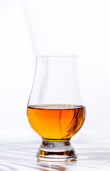 Single malt Scotch whisky in glencairn glass n white background