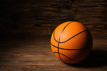 Obraz premium Orange basketball on wooden background
