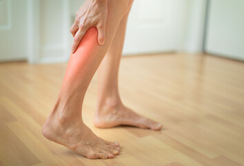 Woman with calf leg pain, muscle cramp,Healthcare concept
