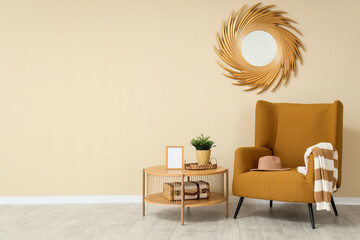 Minimalist interior of living room with comfortable armchair, coffee table and mirror