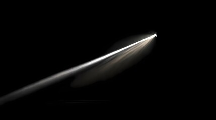 Isolated beam of light slicing through a dark space, illuminating what may be a far off object, creating a mysterious effect
