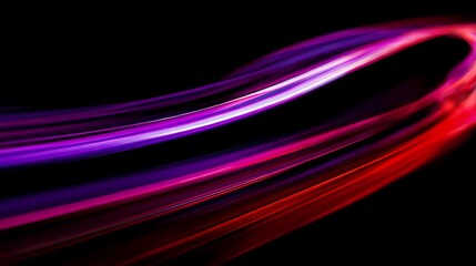 A mesmerizing display of vibrant light trails dance across a deep, dark backdrop, creating a dynamic and captivating visual experience.