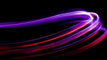 Streaks of vibrant purple and red light dance against a stark black backdrop, creating an abstract and dynamic display of energy.