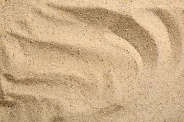 Texture of beach sand as background, closeup