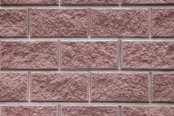 Texture of brown brick wall as background, closeup