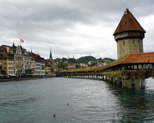 Stunning view of Kapellbrucke, the iconic Chapel Bridge, showcasing the picturesque beauty of Lucerne, Switzerland