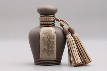 perfume bottle with rope tassels