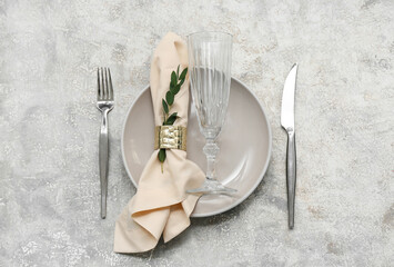 Beautiful table setting with eucalyptus branch on grunge background