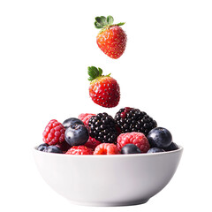 floating strawberries above bowl of mixed berries on white background