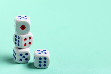 White game dices on turquoise background