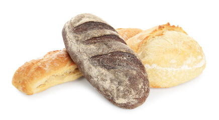 Different loaves of freshly baked bread isolated on white