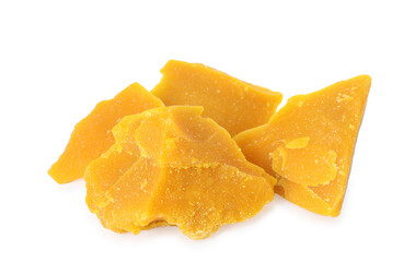 Pieces of natural beeswax for making candles on white background