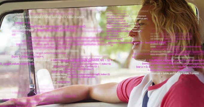 Driving car, animation of pink computer code overlaying scene, focused driver