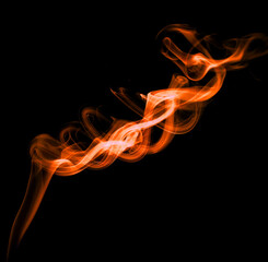 orange smoke, abstract element smog isolated on a black background.  concept of texture mist, fog effect, and cloud for design air pollution