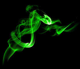 green smoke, abstract element smog isolated on a black background.  concept of texture mist, fog...